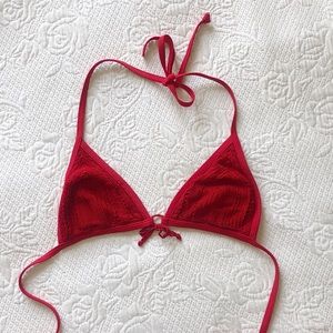 Bright red bikini top with crochet detail